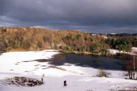 Snow clouds move in above Tarn Hows