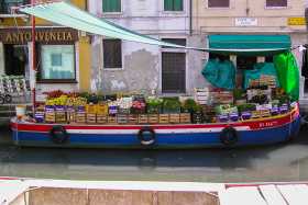 The canals are the lifeblood of Venice - even this greengrocer takes his business to the waterways